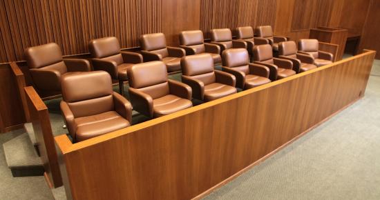 A jury box with two rows of chairs in it